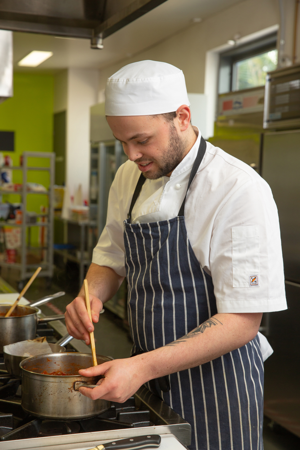 SWTAFE cooking apprentice Ben cooking a red sauce