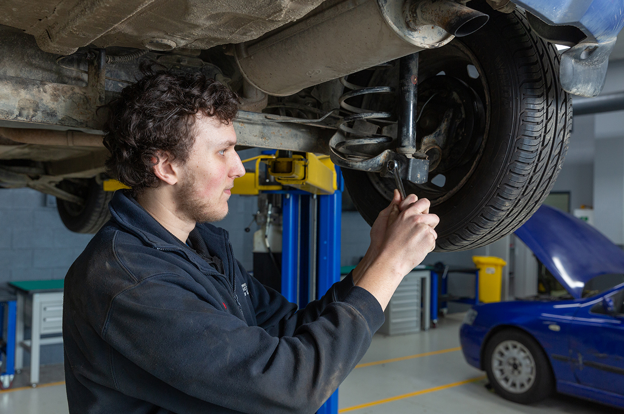 Nathan working on a car